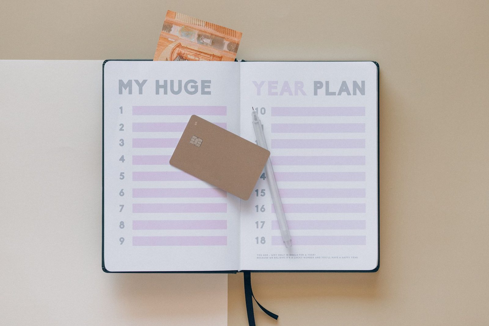 An open annual planner spread showing a blank month-by-month grid