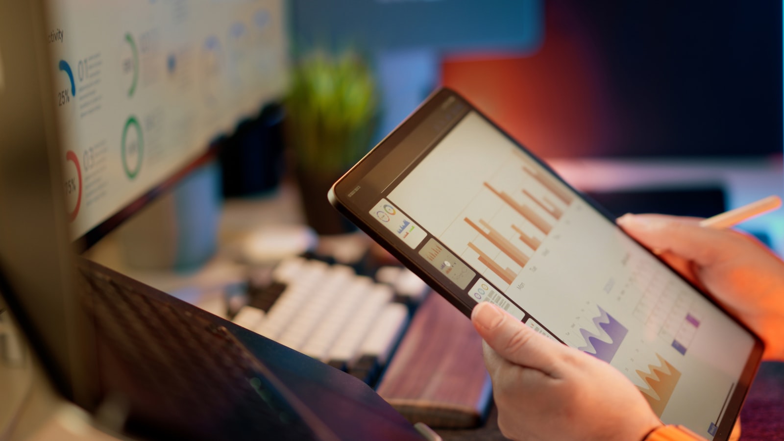 Person analyzing financial data and accounts receivable figures on a tablet